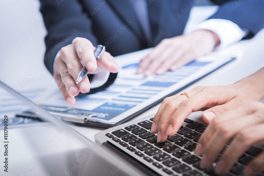 Obraz premium Business adviser analyzing financial figures denoting the progre