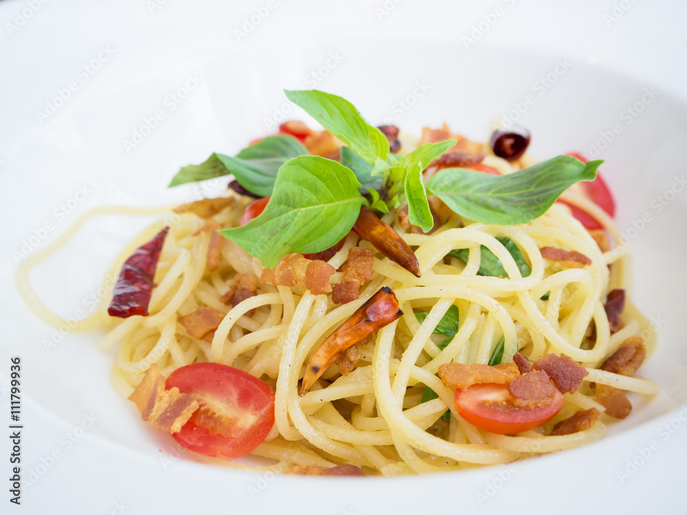 Spicy spaghetti with crispy pork Thai style food on white dish Spicy spaghetti with crispy pork Thai style food on white dish