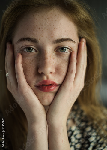 bored beautiful girl with freckles