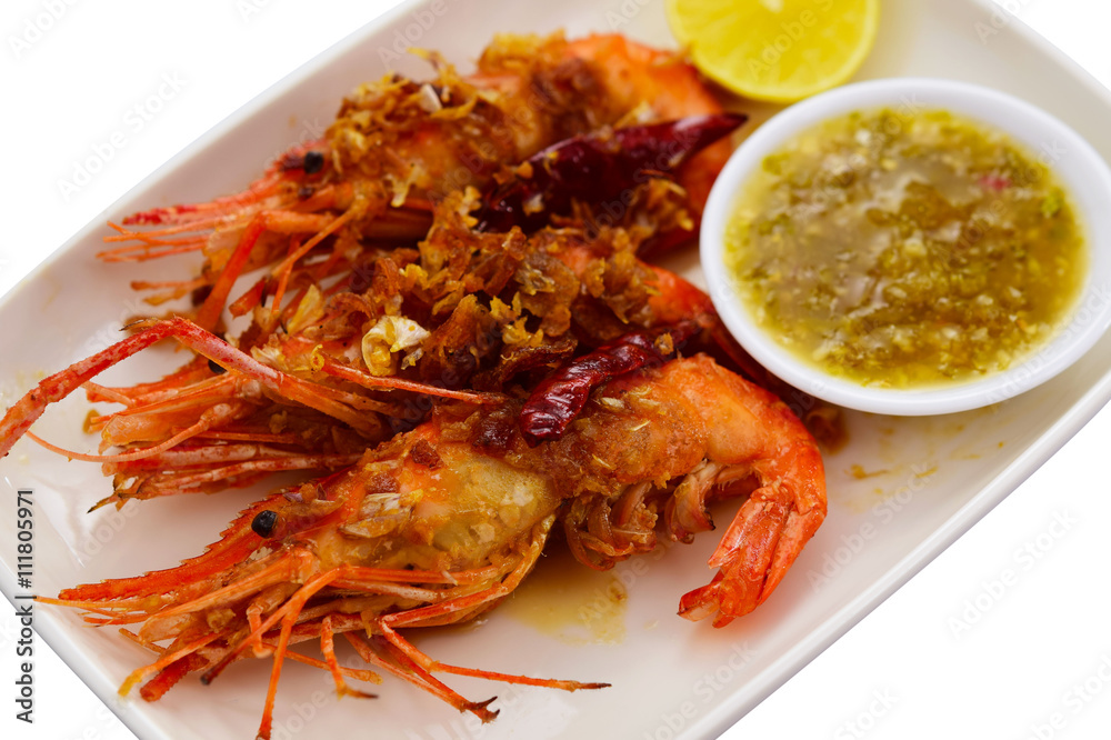 King prawns with deep fried garlic and Seafood sauce on dish on King prawns with deep fried garlic and Seafood sauce on dish on