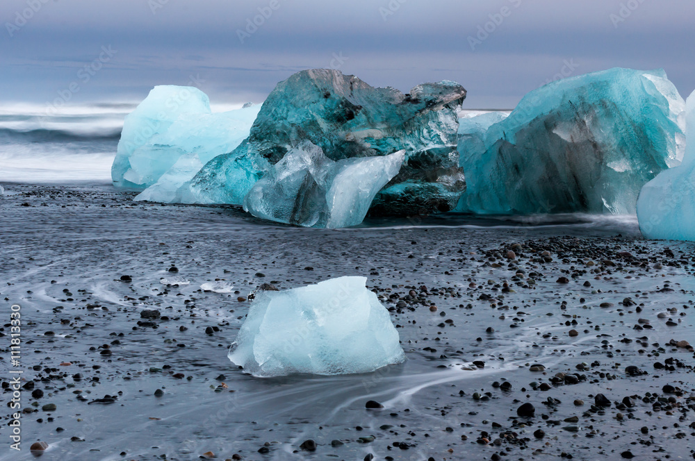 Icebergs on the black sand volcanic beach,  Vatnajokull Glacier, Iceland. 