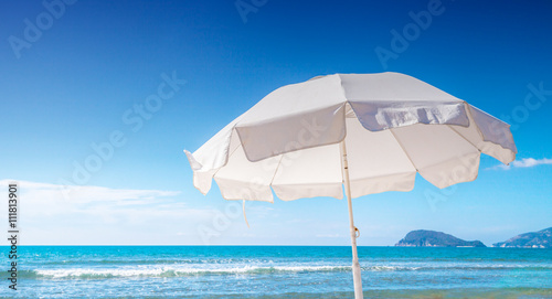Umbrella on tropical beach hot summer day © leszekglasner