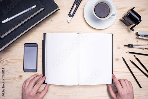 Male hands  notepad and stationery