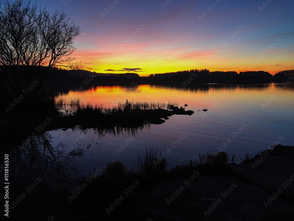 Scenic view of loch of loirston at sunset