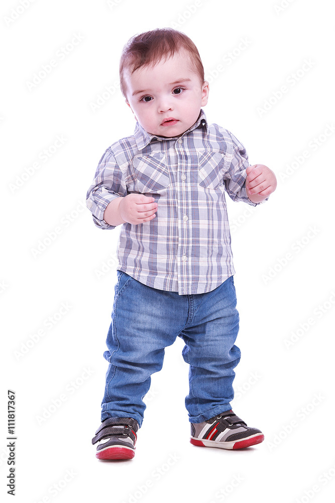 Portrait of small boy in blue trousers striped t-shirt Portrait of small boy in blue trousers striped t-shirt