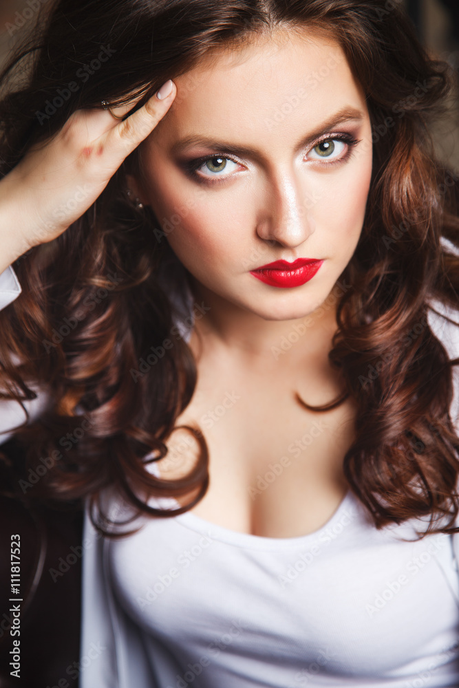 Close-up portrait of beautiful sexy young woman with long brown hair in photostudio Close-up portrait of beautiful sexy young woman with long brown hair in photostudio
