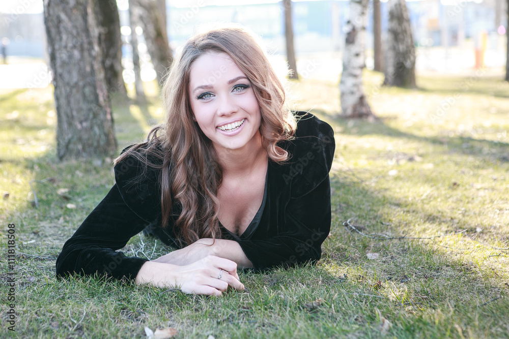 Portrait of a beautiful girl outdoors in black dress Portrait of a beautiful girl outdoors in black dress