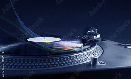Music player playing vinyl music with colourful abstract lines