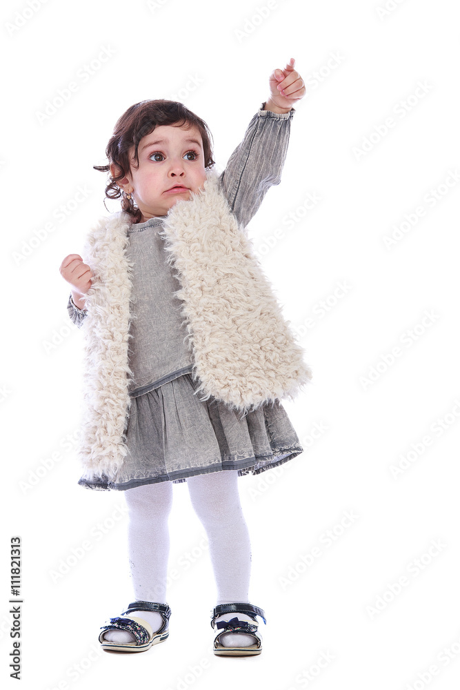 Portrait of little girl in grey clothes on a white background Portrait of little girl in grey clothes on a white background