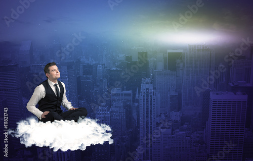 Man sitting on a cloud above the city