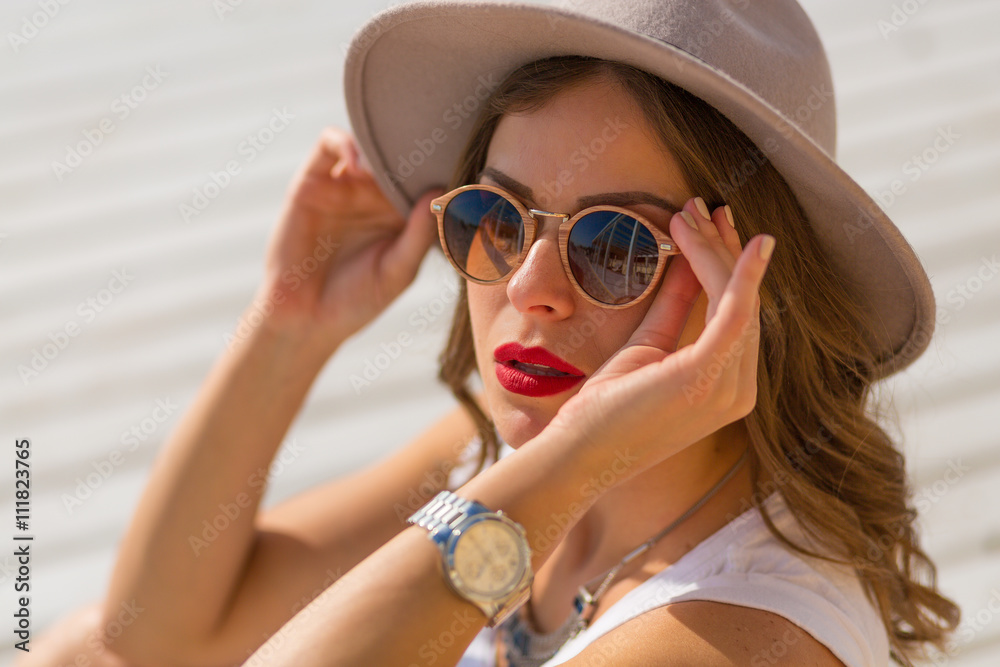 Stylish woman at the summer beach in a hot day Stylish woman at the summer beach in a hot day