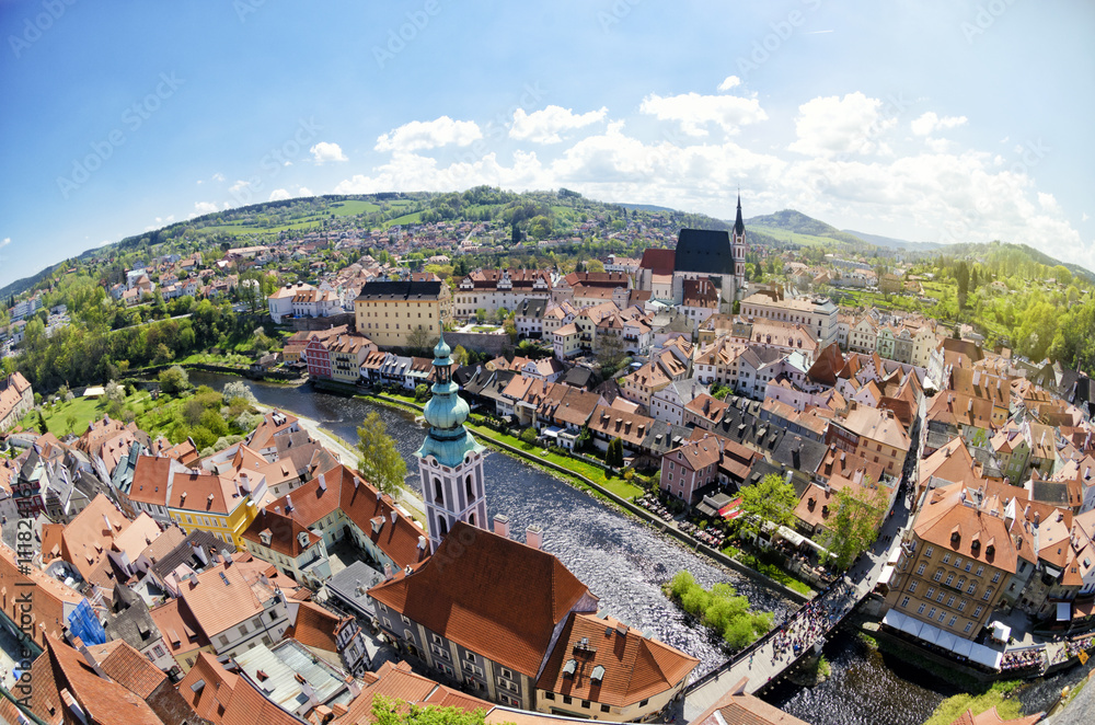 Panoramic aerial view of historical center of Cesky Krumlov, Czech Republic. Spring or summer cityscape. Fisheye lens view of roofs of Cesky Krumlov.