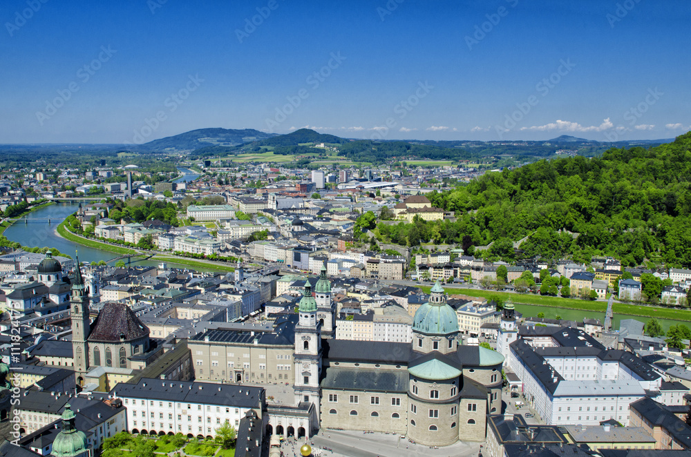 Panoramic aerial view of historical center and architecture of Salzburg, Austria. Beautiful view from Fortress Hohensalzburg. Spring or summer landscape, city and river.  