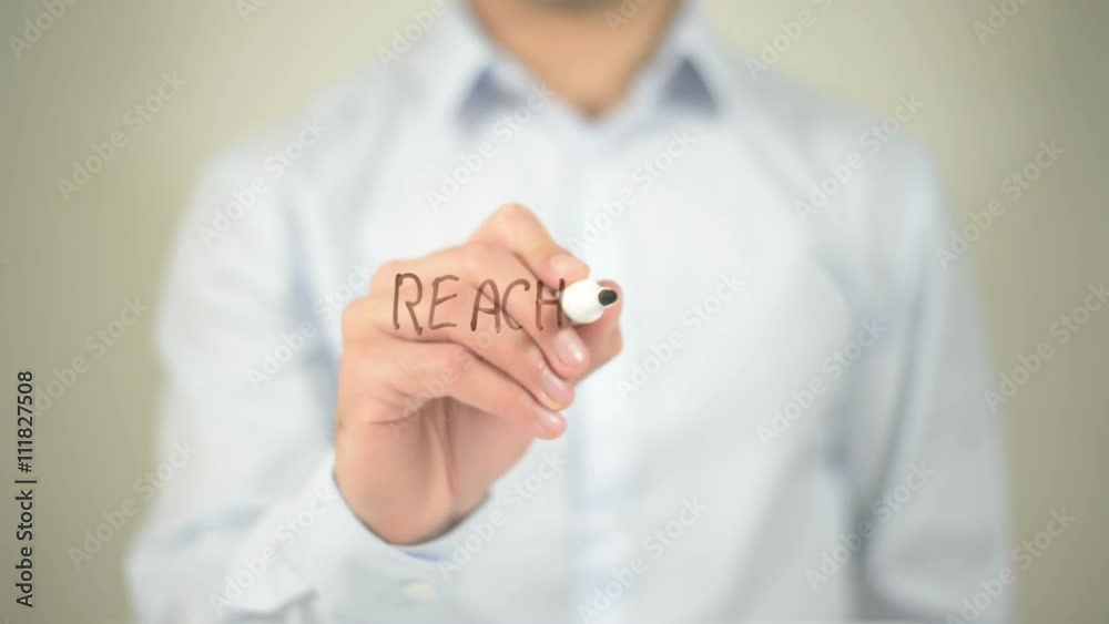Reach Out , man writing on transparent screen Reach Out , man writing on transparent screen