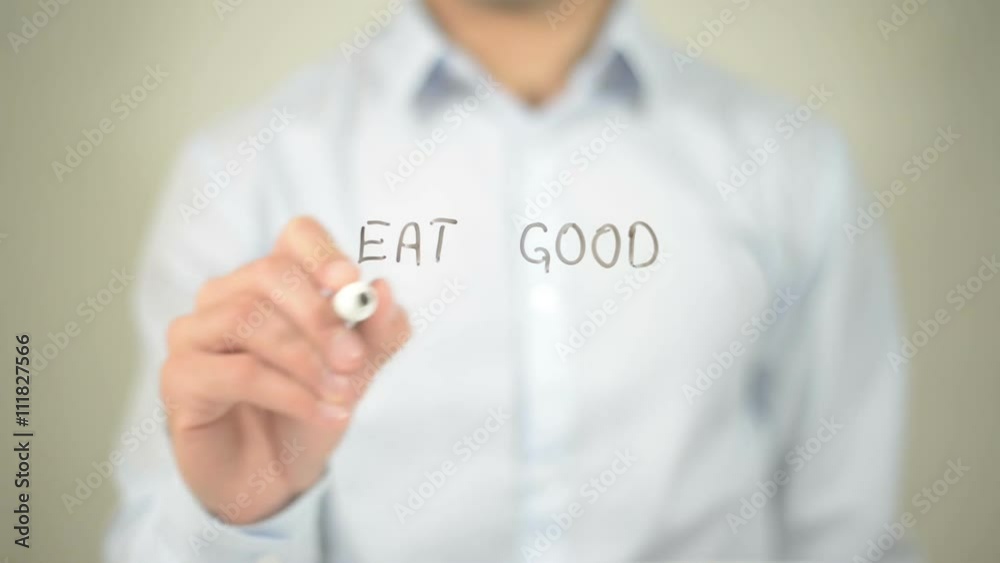 Eat Good Feel Good , man writing on transparent screen Eat Good Feel Good , man writing on transparent screen