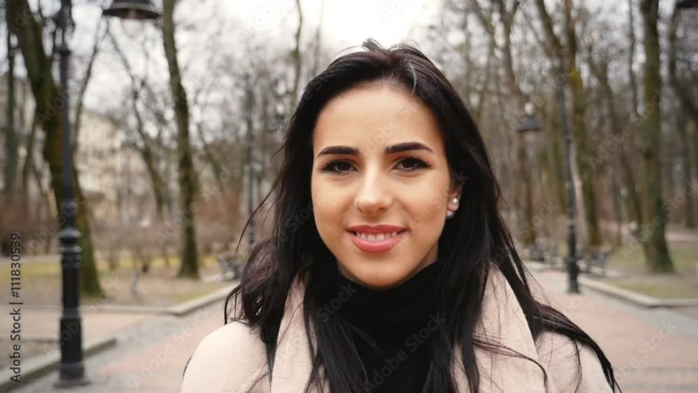 Cute young woman staying alone in the park. Cute young woman staying alone in the park.