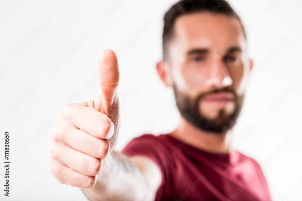 bearded man showing off his thumb up bearded man showing off his thumb up