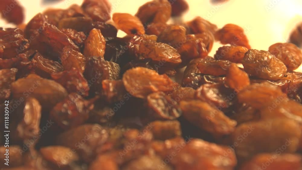 Raisins on a white background. 2 Shots.Vertical pan. Close-up. Raisins on a white background. 2 Shots.Vertical pan. Close-up.