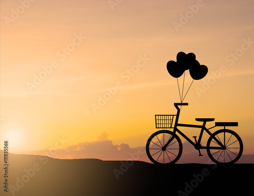 Silhouette of old bicycle with sunset © AnirutKhattirat