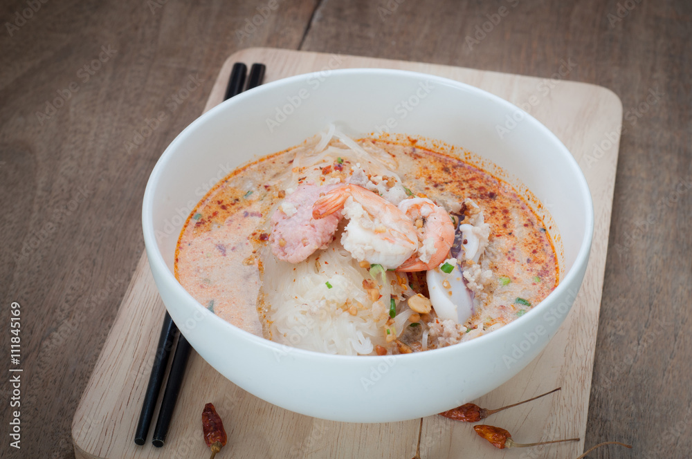 Spicy lemongrass flavored flat noodles with pork and seafood.
