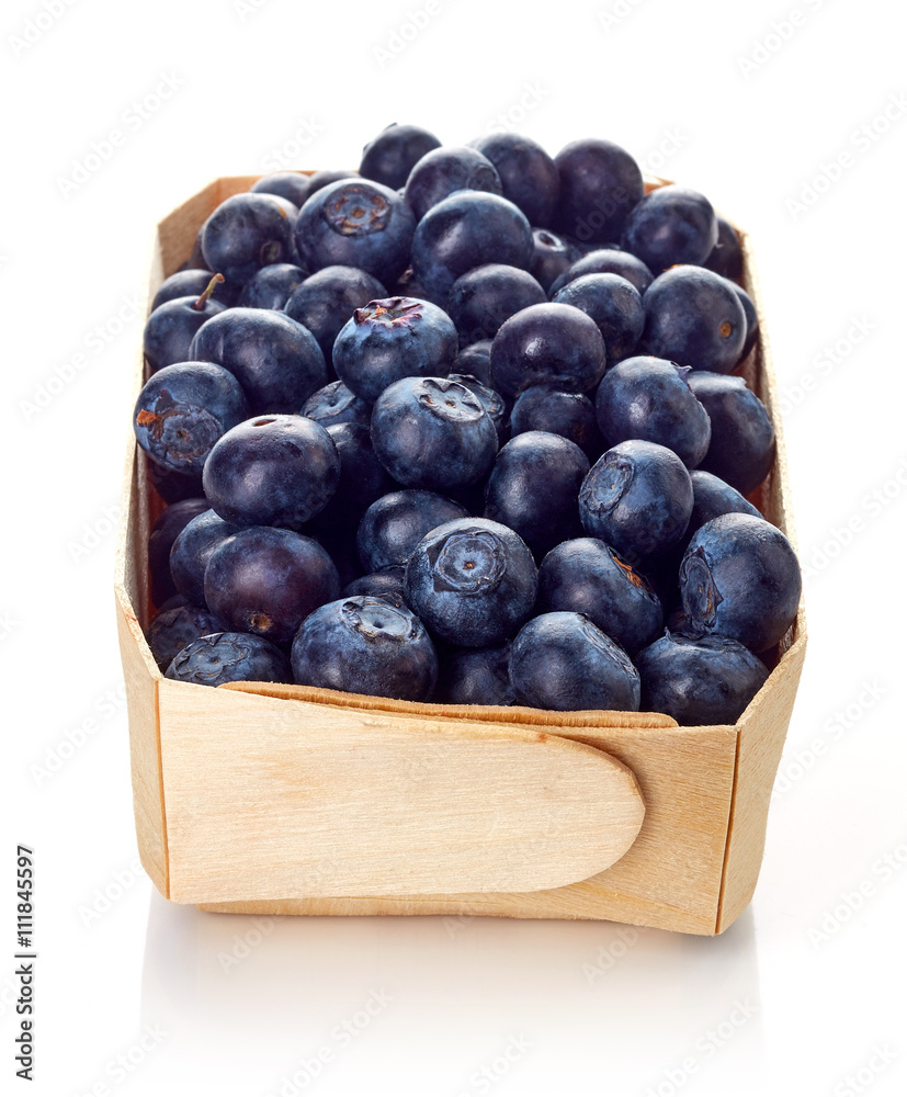 Blueberry in wooden box isolated on white