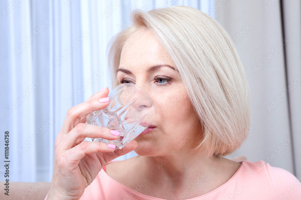 Portrait beautiful middle aged woman drinking water in the morning Portrait beautiful middle aged woman drinking water in the morning