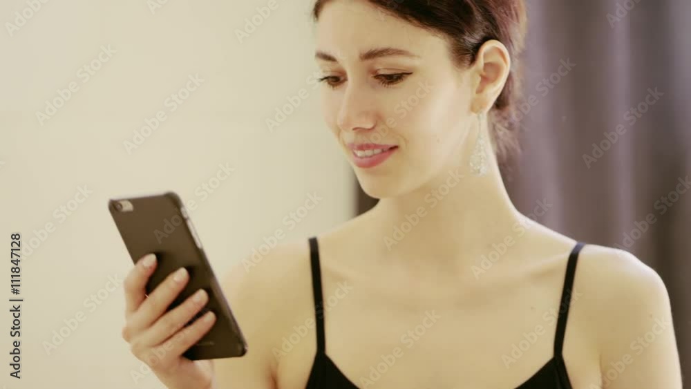 beautiful girl wearing ballet leotard with cellphone beautiful girl wearing ballet leotard with cellphone