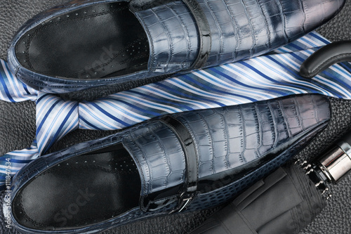 Classic blue shoes, tie, umbrella on the black leather © alekleks