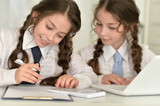 little girls making homework 