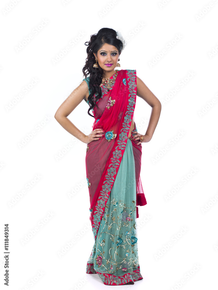 confident young indian woman posing with hand on hips. confident young indian woman posing with hand on hips.