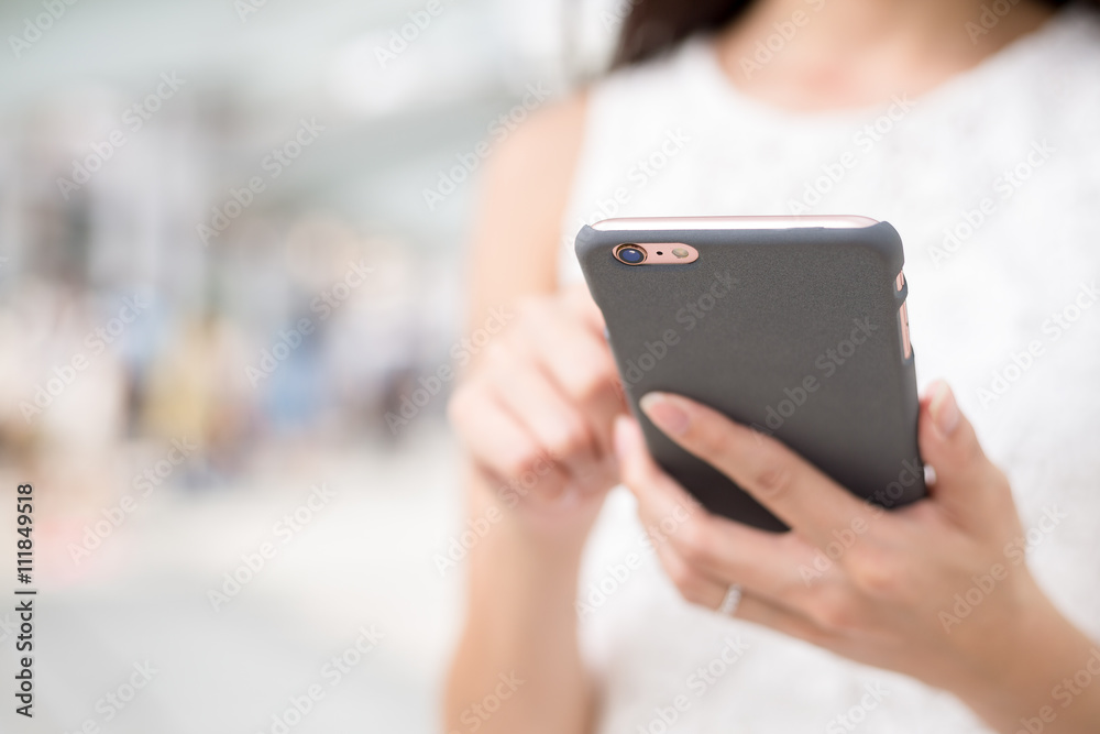 Woman surfing internet on mobile phone