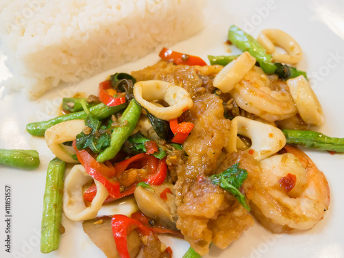 Rice with stir-fried seafood and basil