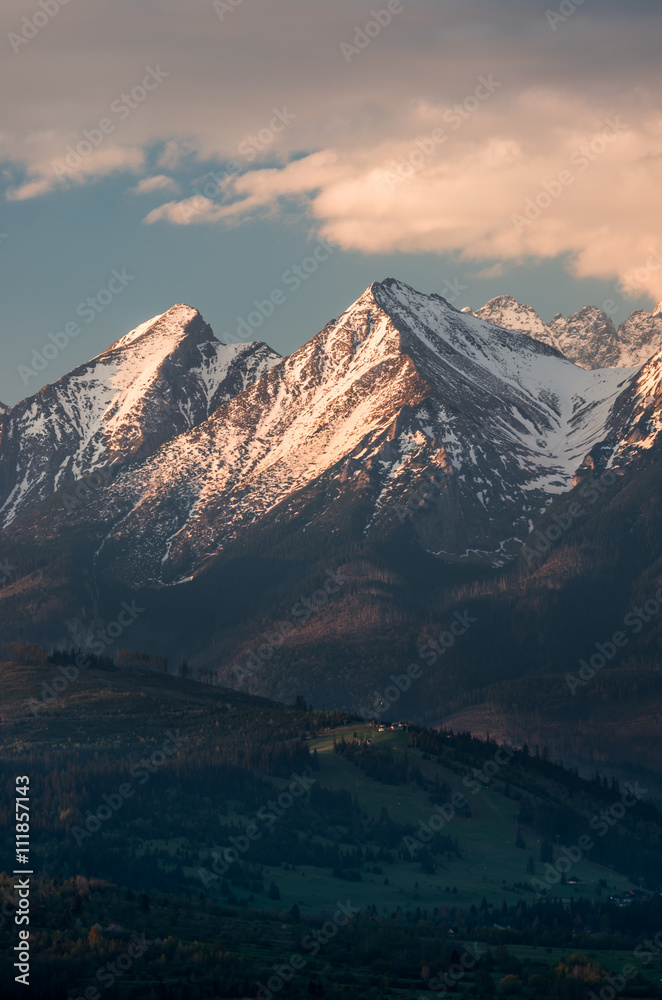 Obraz premium Cloudy Tatra mountains in the morning, covered with snow
