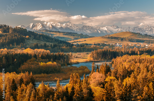 Beautiful autumns panorama over Bialka river gorge and Spisz highland to snowy Tatra mountains, Poland