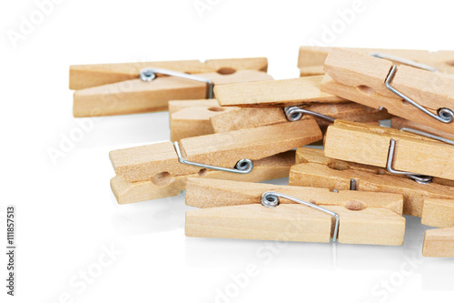 Wooden clothespins close-up isolated on white.