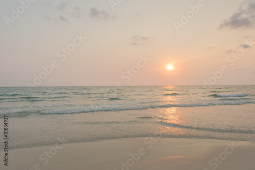 Sunshine with gentle wave at the tropical beach in morning