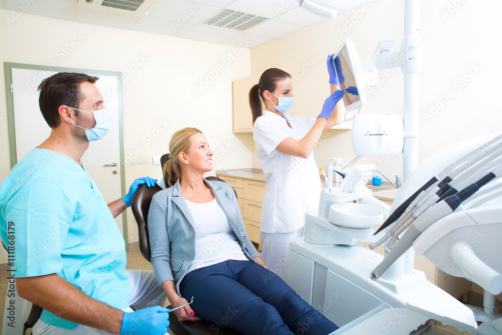 Fototapeta premium Adult woman getting her checkup at the Dentist