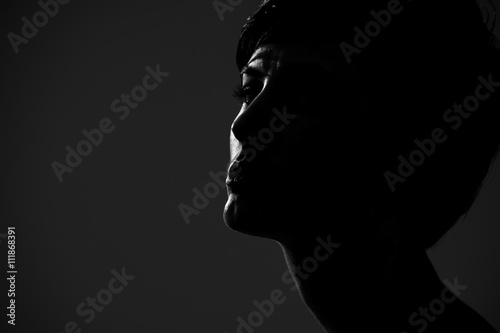 Abstract silhouette portrait of short hair woman looking at camera