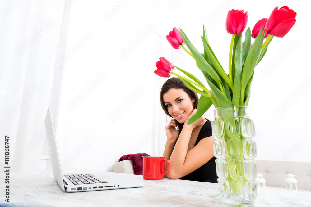 Young beautiful woman using a Laptop at home Young beautiful woman using a Laptop at home