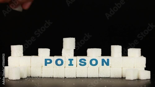Man's hand puts sugar cubes on which is inscriptionthe word poison