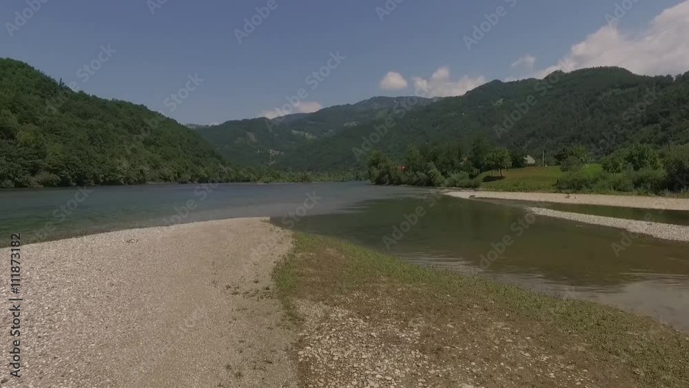 Aerial view of the river Drina Serbia. Low flight over the forest river.Footage recorder from drone in full HD resolution.Aerial view of the water and of the river bank Aerial view of the river Drina Serbia. Low flight over the forest river.Footage recorder from drone in full HD resolution.Aerial view of the water and of the river bank