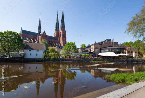 Uppsala Church with its reflection on the river.