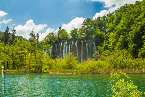 Beautiful landscape  waterfall and clear green water in the Plitvice Lakes National Park in Croatia 