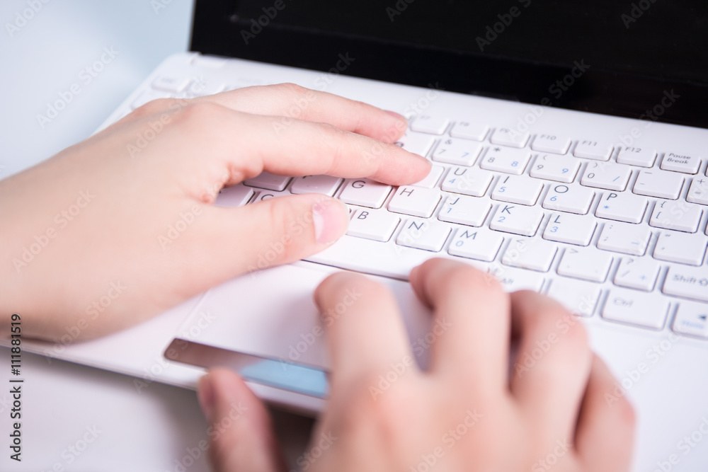 business woman's hands typing on laptop keyboard business woman's hands typing on laptop keyboard