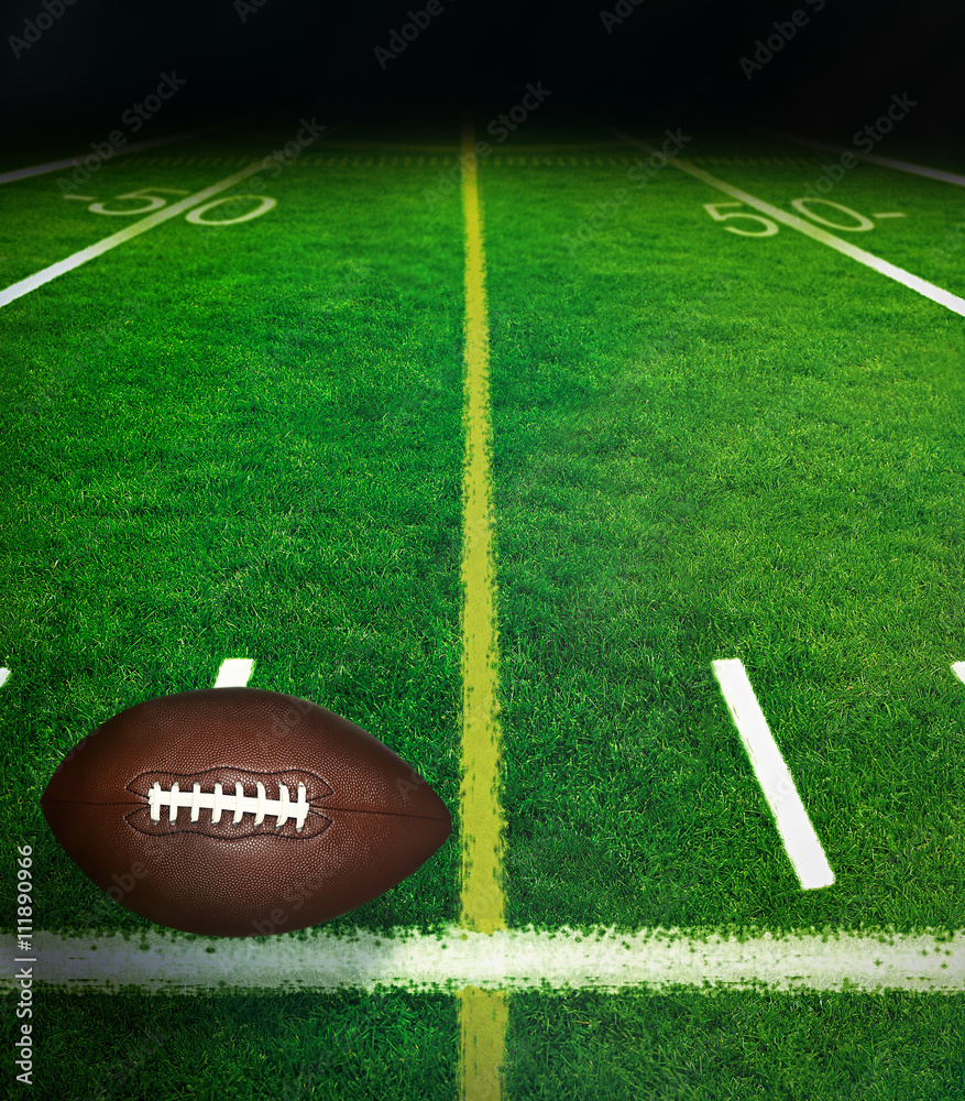 American football on green field stadium at night American football on green field stadium at night