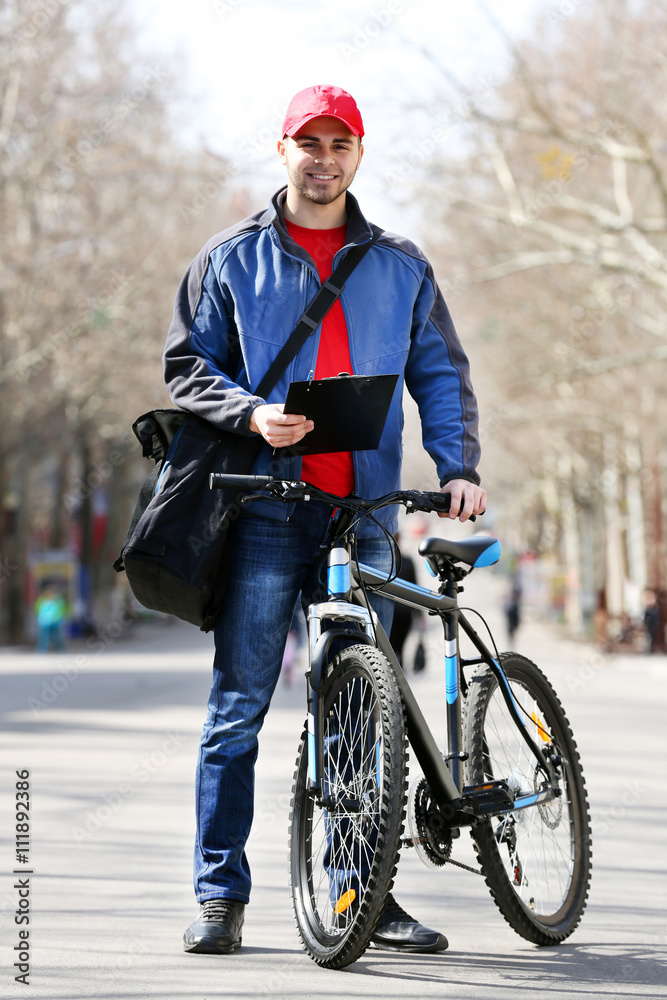 Young man with bike outside Young man with bike outside