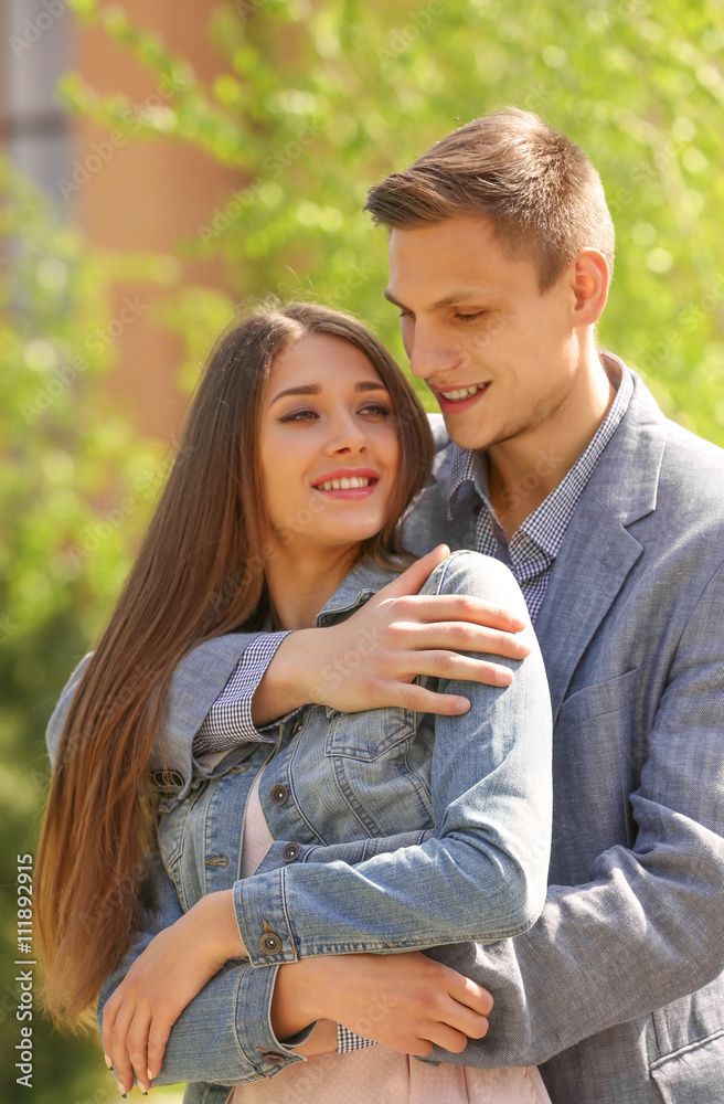 Fototapeta premium Young loving couple in spring park