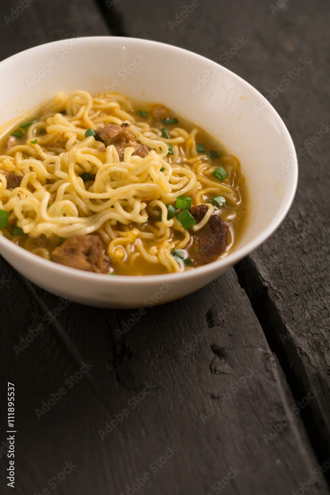 Asian quick noodles on wood background photo Asian quick noodles on wood background photo