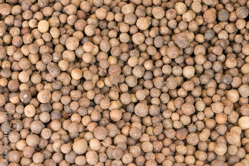 Spices of black pepper grains closeup