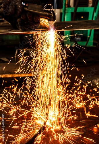 Sparks while cutting steel in the factory